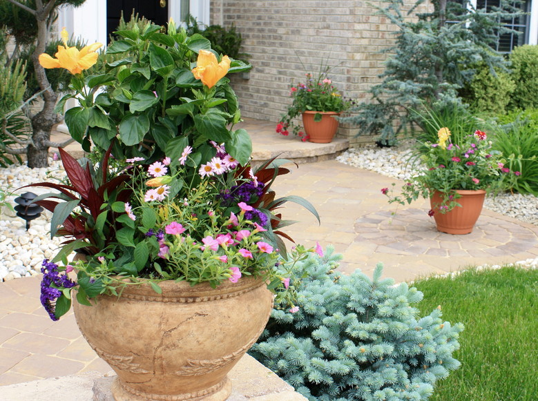 The Joys Of Container Gardening Town And Country Gardens Patio Pots Welcome Visitors